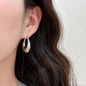 Polished silver teardrop earrings for women in a minimalist water drop design