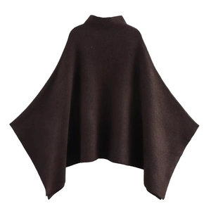Chic dark brown asymmetric knit poncho with high turtleneck collar on white background