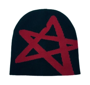 Close-up of the knitted texture and bold red star pattern on this winter beanie
