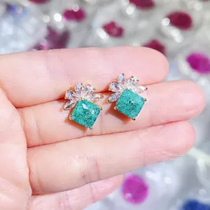 Luxury green zircon cluster earrings with gold finish and white marquise petals