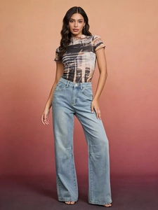 Vintage high waist loose wide leg jeans paired with colorful printed mesh top