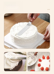 Detail of stainless steel cake spatula with ergonomic reddish wood handle and rivets