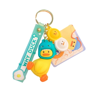 Porte-clés canard jaune mignon avec capuche dinosaure vert et étiquette en caoutchouc