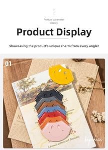Close-up of colorful leather smiley face bookmarks in eight colors on newspaper