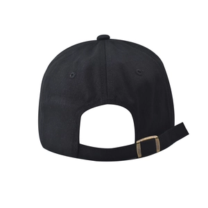 Detail view of cotton baseball cap with adjustable strap and brass metal buckle