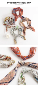 Detailed view of vintage silk-like square scarves with baroque and paisley floral patterns