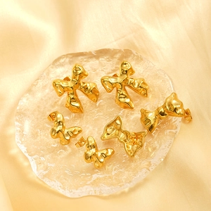 Polished 18K gold plated stainless steel bow earrings with a liquid metal texture