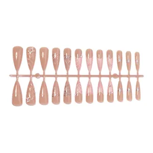 Pink press-on nails in long almond shape with silver 3D bows and star decorations