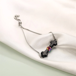 Detail of adjustable stainless steel box chain bracelet with cross and iridescent beads