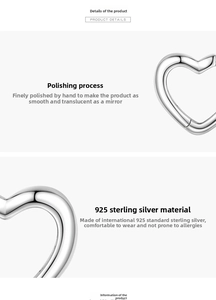 Detail shot of polished 925 sterling silver heart hoop earrings with a mirror finish