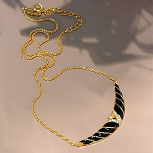 Vintage 18K gold black enamel arch necklace with sparkling rhinestone and gold stripes