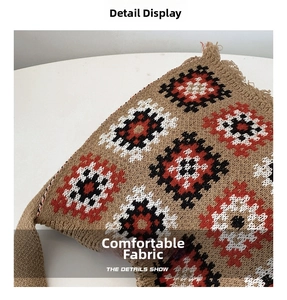 Detailed macro view of the ethnic geometric diamond knit pattern on this khaki tote bag