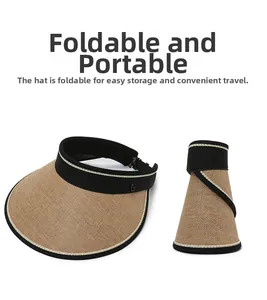 Foldable women's straw sun visor hat with black trim and portable roll-up design