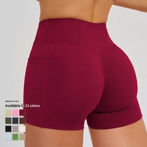 High-waisted burgundy yoga shorts with cross waist and side pockets for outdoor sports