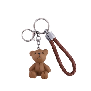 Creative brown resin bear keychain with woven leather strap and silver metal clasp