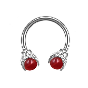 Detail of horseshoe ring with dragon claws holding translucent red beads in medical steel