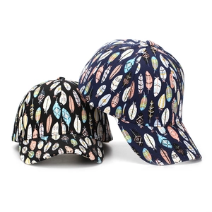 Set of feather print baseball caps in black and navy blue with vibrant artistic patterns