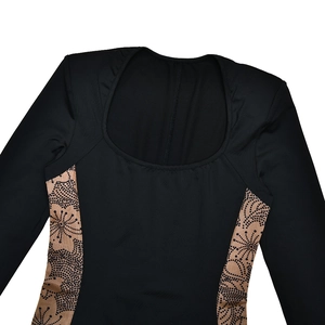 Detail view of square neck black bodysuit featuring geometric pattern side panels