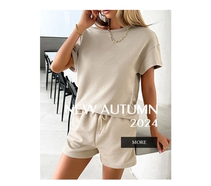 Close-up of beige knit two-piece set with textured waffle pattern and drawstring shorts