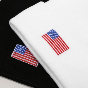 Unisex knit beanie with American flag patch in black and white styles for winter