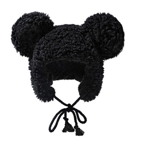 Detail shot of the plush black Mickey ears hat with soft faux fur texture and tassel ties