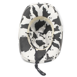 Top view showing the inner structure and black adjustable drawstring of the cow print hat