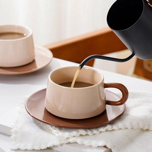 Nordic ceramic coffee cup and saucer set with contrast brown handle in sunny tea scene
