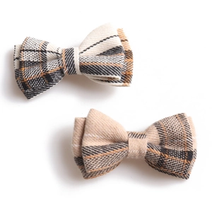 British style plaid pet collar set with bowknot and bell on a white background