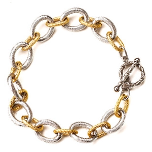 Detail of two-tone gold and silver cable link bracelet with secure OT toggle clasp