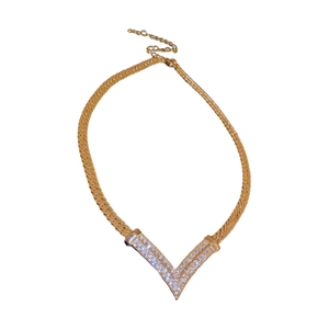 Elegant gold plated V-shaped pendant necklace with sparkling clear crystals for women