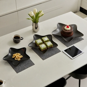 Minimalist black matte star shaped decorative tray for snacks and desserts in modern home decor