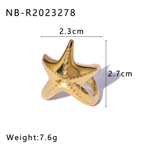 Detail view of golden starfish ring dimensions 2.3cm by 2.7cm and weight 7.6g