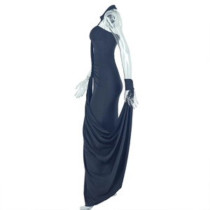 Detail view of the side ruching and slim fit cut on this elegant black halter maxi dress