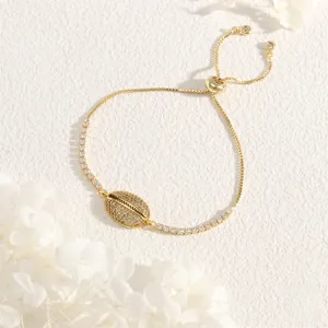 Macro shot of gold shell bracelet with zircon micro-paving and adjustable slider