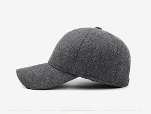 Side view of dark gray wool baseball cap with thermal lining and six-panel structure