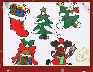 Detail showing five DIY PVC Christmas stickers with reindeer, snowman and tree motifs