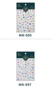 Detailed comparison of 5D embossed butterfly nail decals in multi-color and laser blue styles