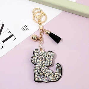 Detailed macro view of the crystal cat keychain with sparkling rhinestones and a black tassel