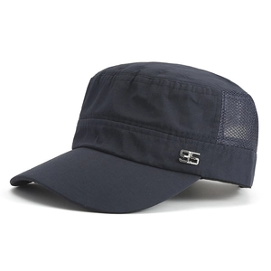 Detail of navy flat top cap featuring mesh side panels and silver 95 metal logo emblem