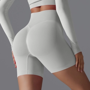 Detail showing seamless high-waist knit and scrunch butt stitching on gray yoga shorts