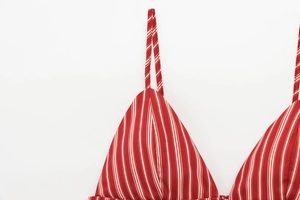 Close-up of red and white striped fabric showing fine texture and clean stitching detail