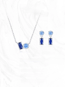 Detail view of S925 silver jewelry set featuring blue sapphire squares and round diamonds