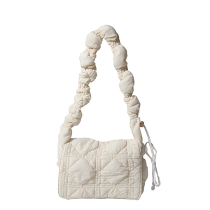 Quilted nylon shoulder bag in creamy white with a trendy pleated cloud-style strap