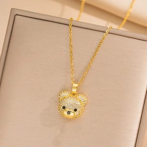 Cute teddy bear necklace with sparkling cubic zirconia in a premium beige jewelry box