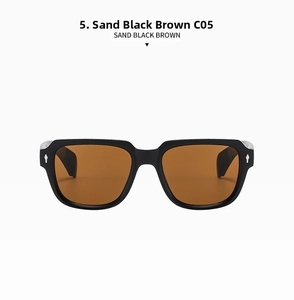 Detail view of square sand black frame sunglasses with brown lenses and silver rivets