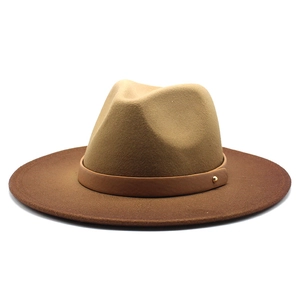 Detail of the khaki and dark brown wool fedora hat with a premium leather band and gold stud