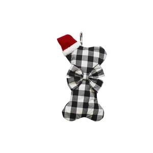 Bone-shaped Christmas stocking for pets with black and white buffalo plaid and red hat