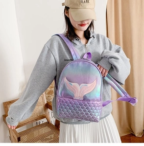 Close-up of holographic purple mermaid backpack with embroidery and scale texture