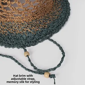 Detail of two-tone straw hat featuring built-in memory wire brim and chin strap with wood beads