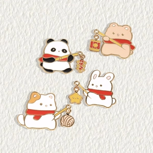 Cute enamel animal pins featuring panda rabbit and cat with winter scarves on a soft background
